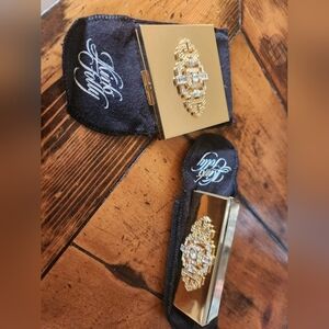 Kirks Folly compact and lipstick tube holder.